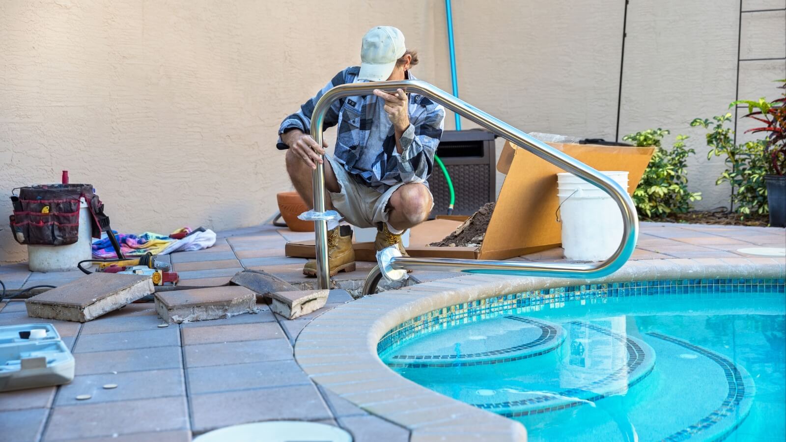 Worker Installing Swimming Pool Handle