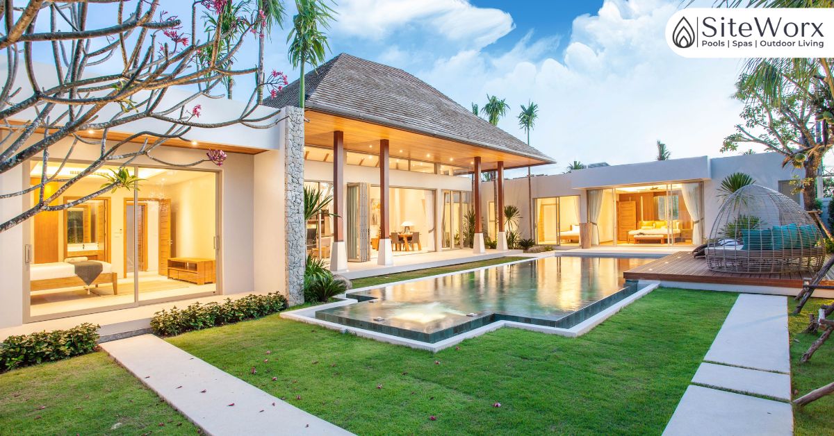 Blog 1 Backyard swimming pool in Tampa featuring a custom design with modern landscaping and outdoor living space.